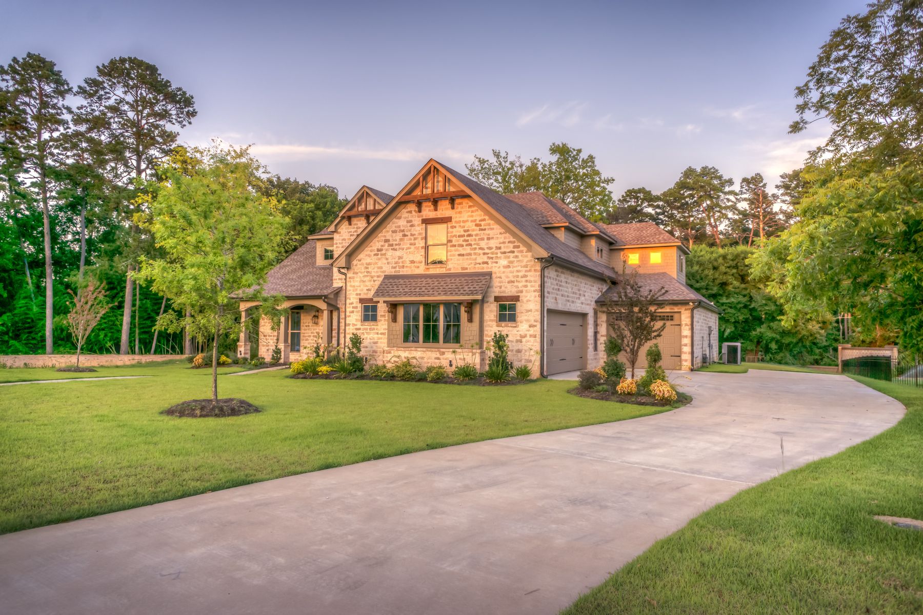 Newly built custom brick home at golden hour